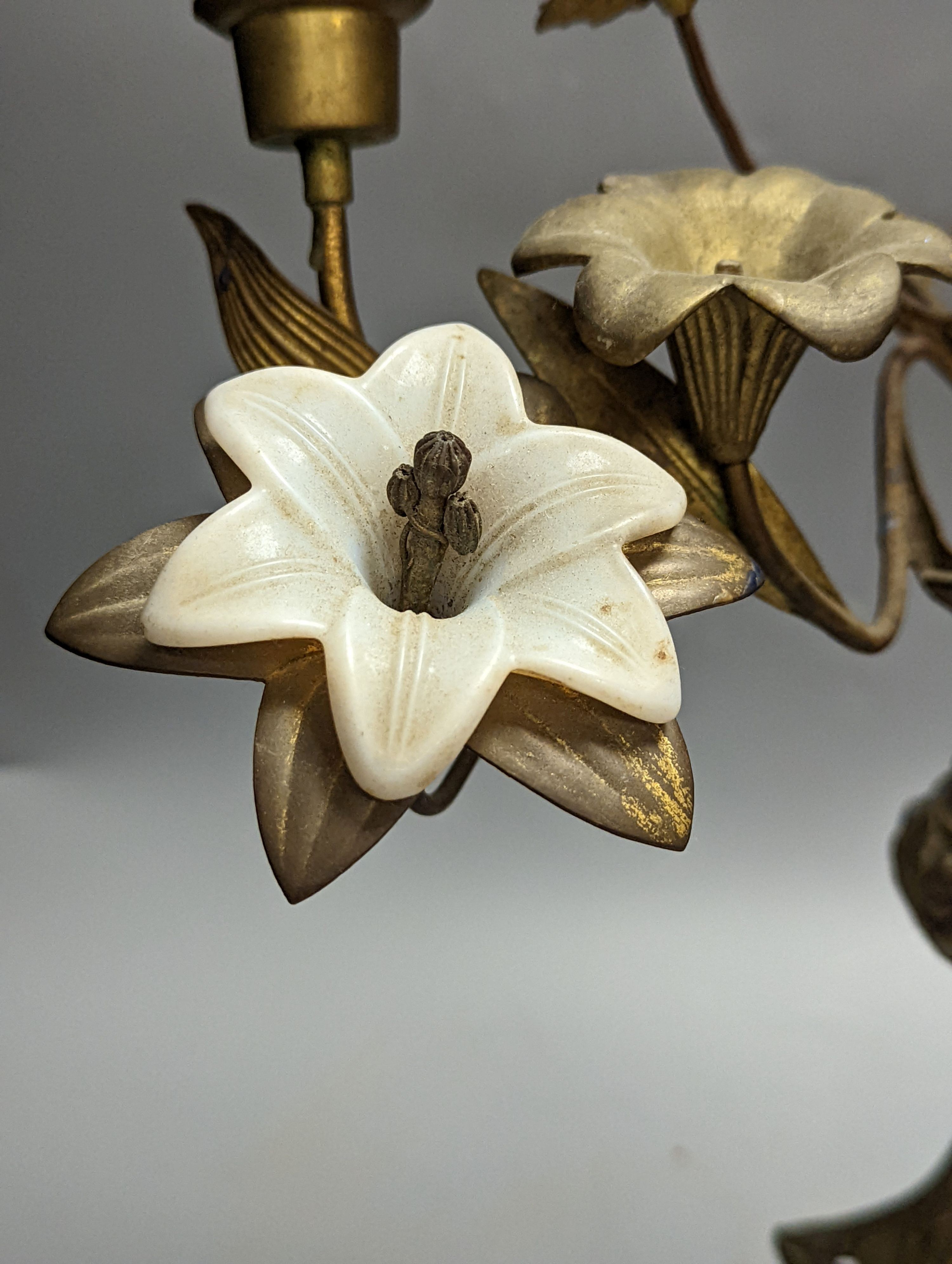 A Victorian cast gilt metal candelabrum, mounted with glass flower heads